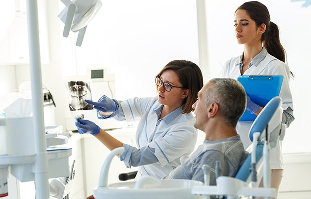 Patient in Shelbyville talking to dentist about dental implant failure