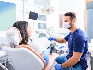 Dentist and patient talking in dental office