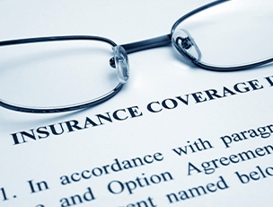 glasses and a dental insurance form 