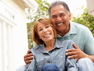 smiling older couple outside