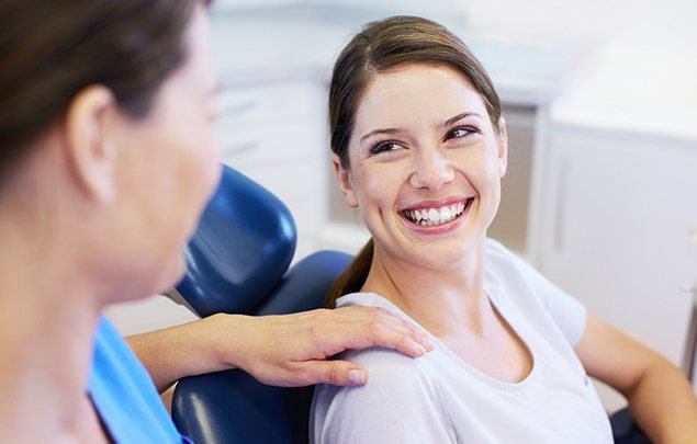 Woman smiling at dentist