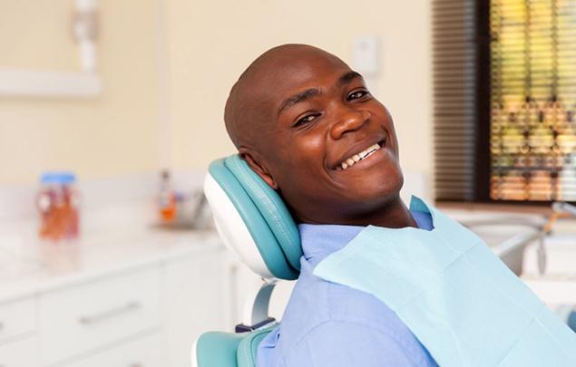 A man sitting in a dental chair