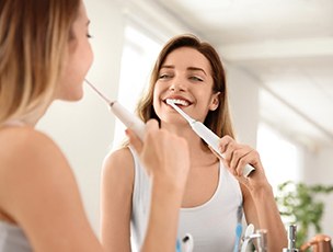 Woman brushing her teeth