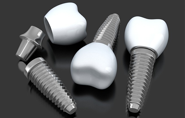 Three illustrated dental implants with dental crowns