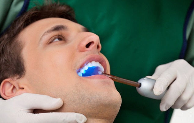 A dental patient receiving bonding for Lumineers