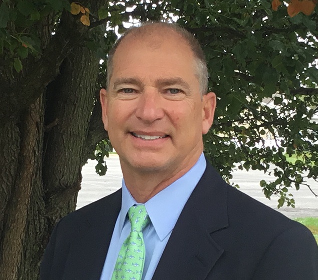 Selbyville dentist Doctor James K Kramer smiling in suit