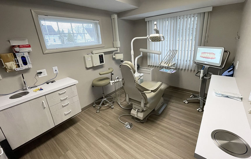 Dental exam room with light gray walls