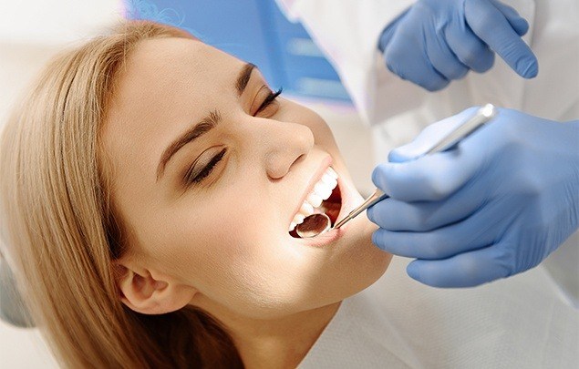 Woman receiving dental checkup