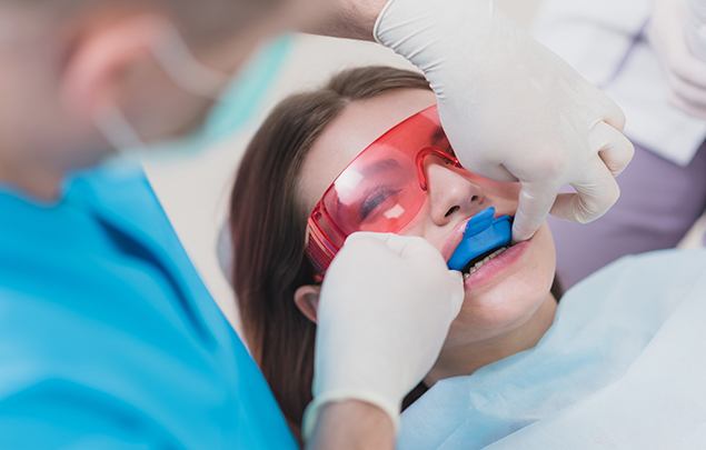 Dental patient receiving fluoride treatment