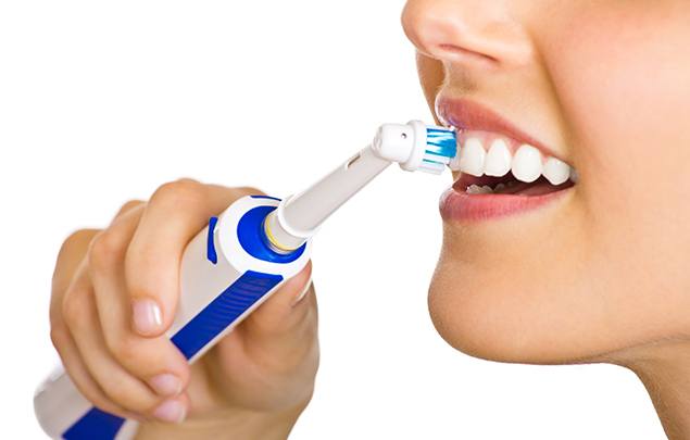 Close up of person brushing their teeth