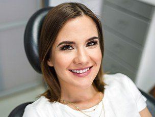 Woman in dental chair smiling