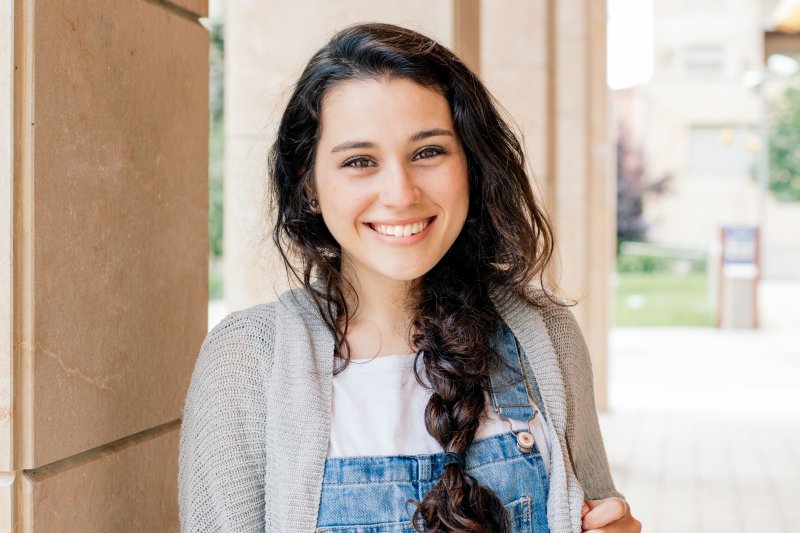 Teenage girl smiling at school