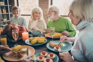 mature woman enjoying thanksgiving meal 