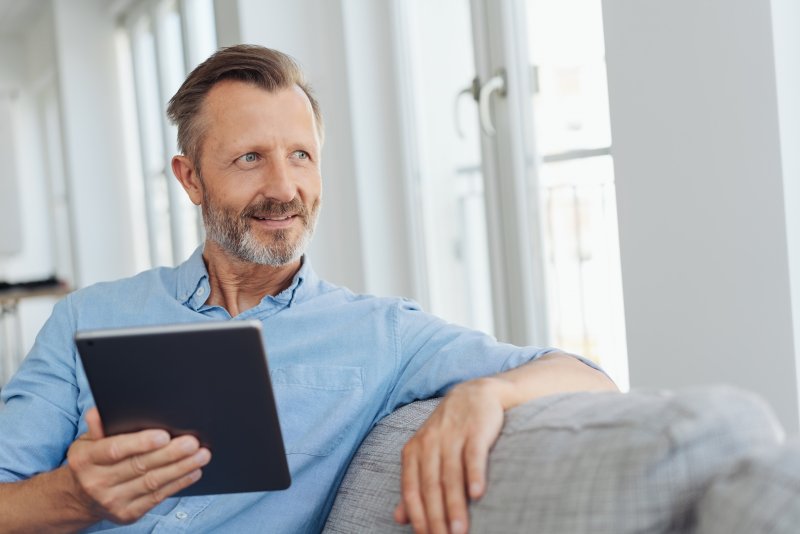 man smiling and planning for dental implant surgery