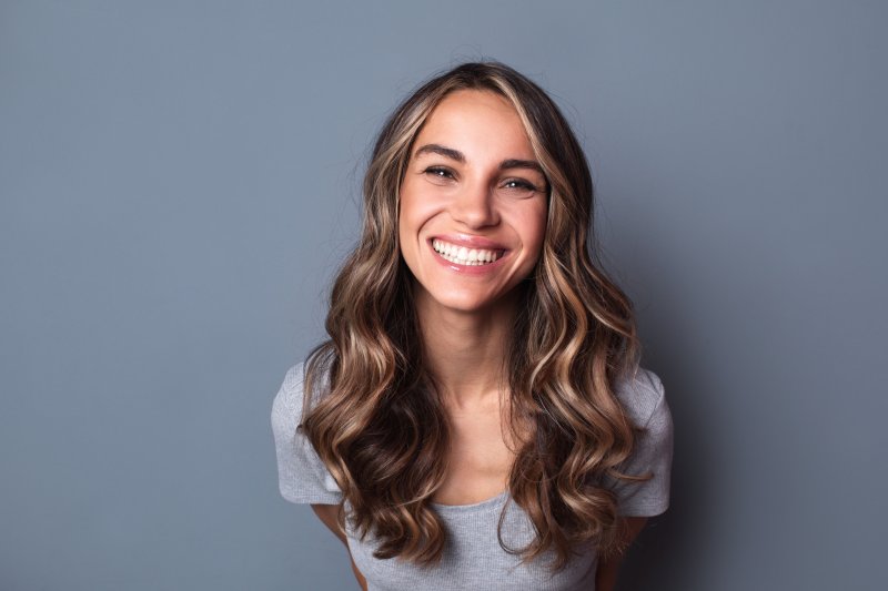 smiling person after getting dental fillings