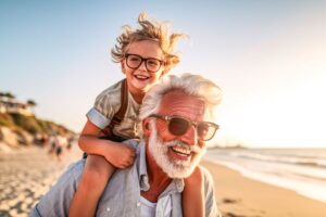 Happy senior man playing with his grandchild